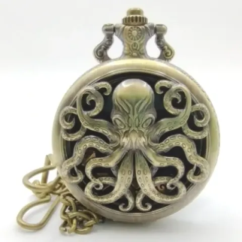 Porte-dés en métal avec mini-kit polyédrique: Cthulhu doré avec pochette en suédine noire