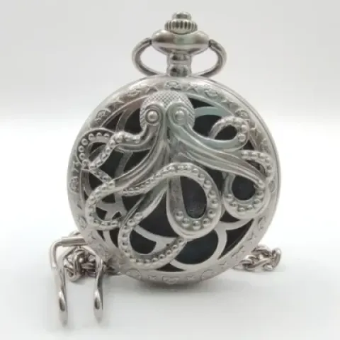 Porte-dés en métal avec mini-kit polyédrique: kraken argenté caverneux avec pochette en suédine noire