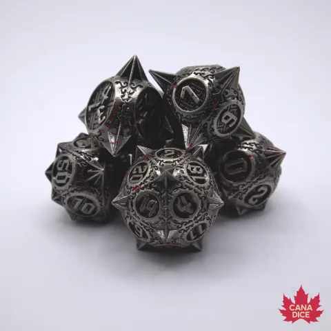 Spiky metal dice:bloodied silver in a black suedecloth bag