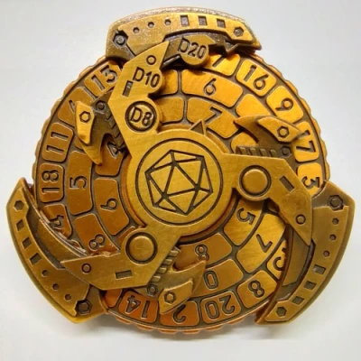 Dice spinner: Triskèle machinal - doré avec noir dans une boîte