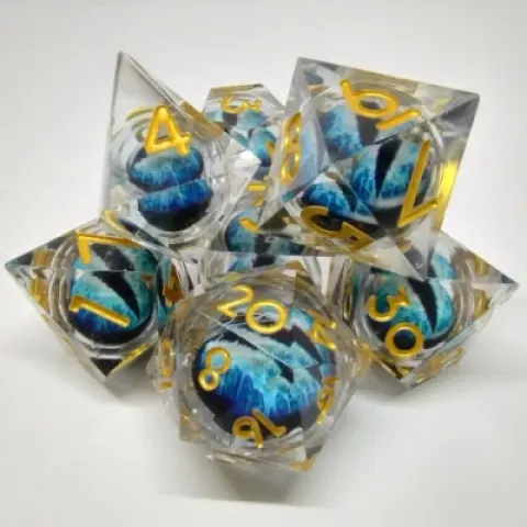 Kit de dés "Liquid Core" Oeil de Dragon - translucide avec oeil bleu dans une bouteille avec couvercle dévisable