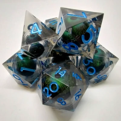 Kit de dés Oeil de Démon - noir avec oeil vert dans une bouteille avec couvercle dévisable